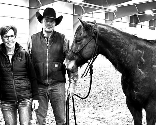 Carolyn and Russ Kucera with one of their horses.